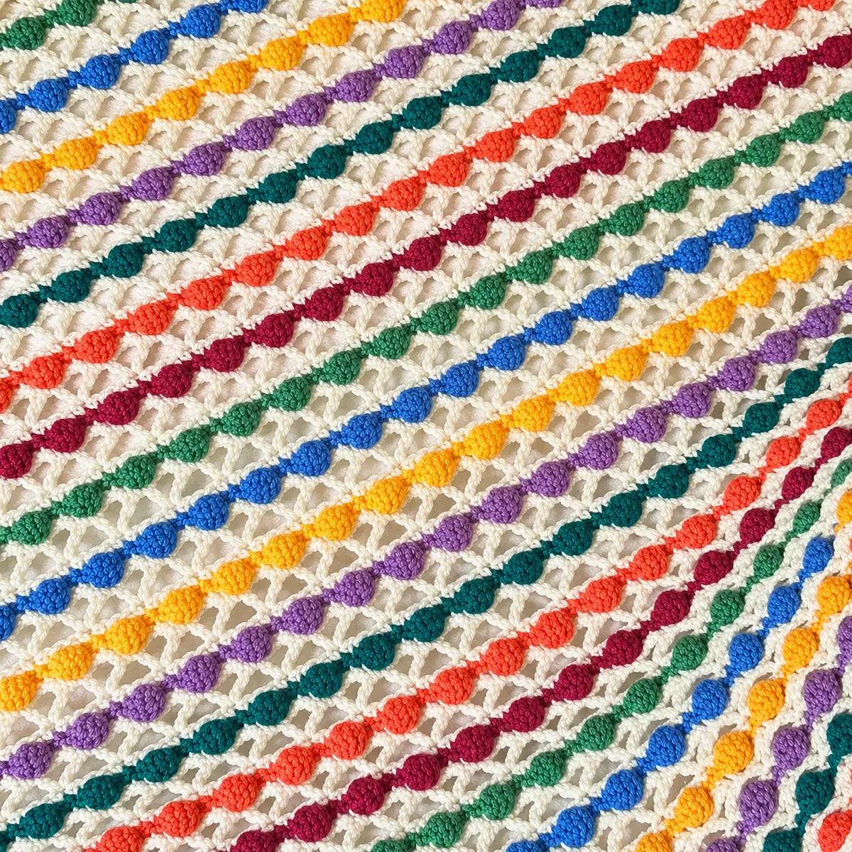 Rainbow Bobble Lace Crochet Baby Blanket | Handmade Colorful Artisan Blanket | Lively Distinct Designs. Lively Distinct Designs Inc